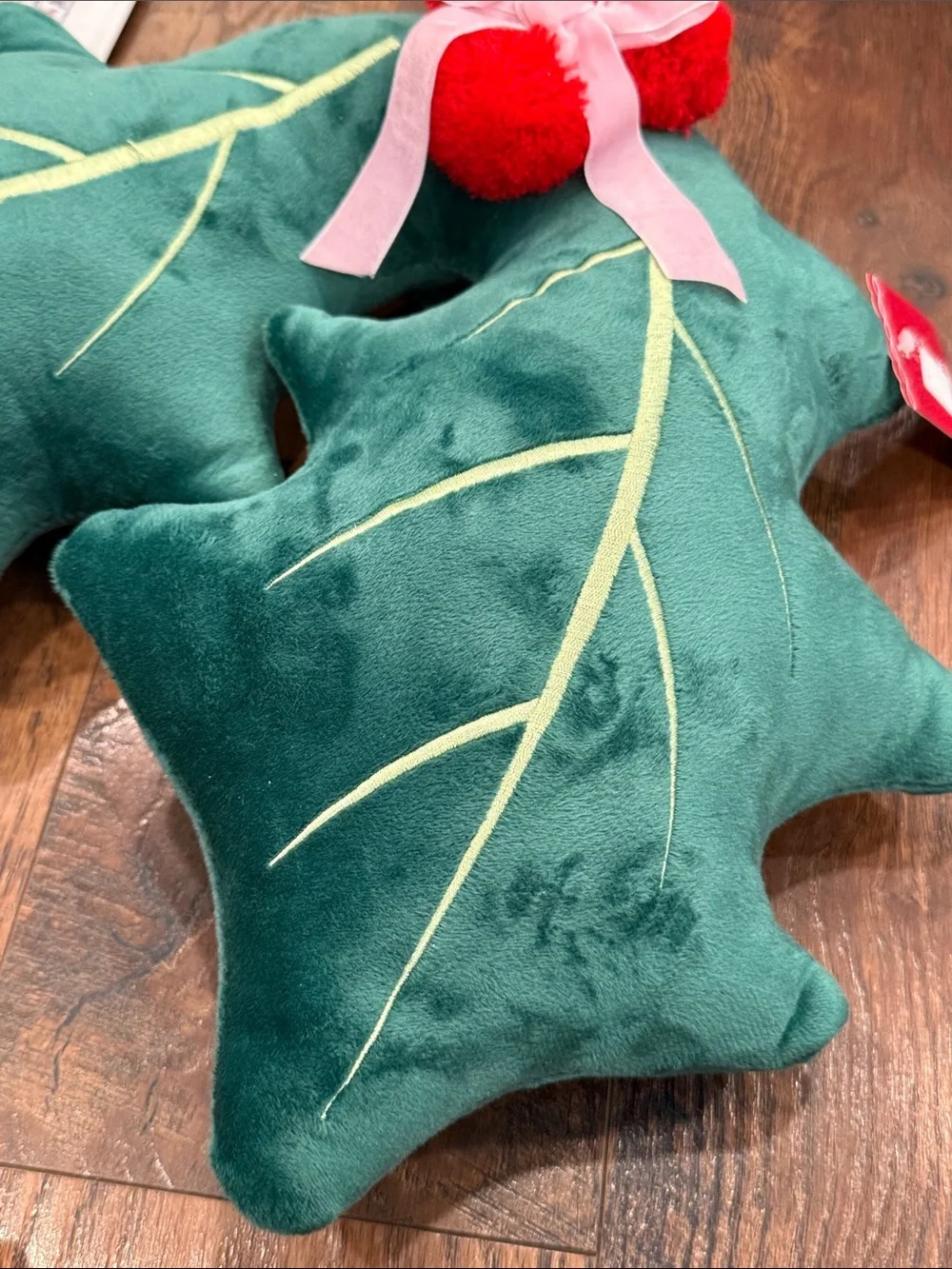 Green Holly Leaf Throw Pillow Pair with Red Pom Accents